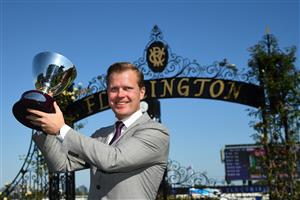 MELBOURNE, AUSTRALIA - MARCH 12: Trainer Ed Cummings poses with trophy after Duais won Race 7, the Tab Australian Cup, during Melbourne Racing at Flemington Racecourse on March 12, 2022 in Melbourne, Australia. (Photo by Vince Caligiuri/Getty Images)
