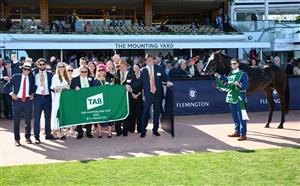 MELBOURNE, AUSTRALIA - MARCH 12: Connections of Duais pose after winning Race 7, the Tab Australian Cup, during Melbourne Racing at Flemington Racecourse on March 12, 2022 in Melbourne, Australia. (Photo by Vince Caligiuri/Getty Images)
