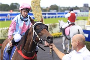 SYDNEY, AUSTRALIA - MARCH 12: Reece Jones on Invincible Kiss returns to scale after winning race 1 the Midway Handicap during Sydney Racing Chandon Ladies Day at Rosehill Gardens on March 12, 2022 in Sydney, Australia. (Photo by Mark Evans/Getty Images)