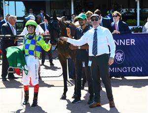 MELBOURNE, AUSTRALIA - MARCH 12: Craig Williams poses with Jerome Hunter after riding Barb Raider to win Race 5, TAB Kewney Stakes, during Melbourne Racing at Flemington Racecourse on March 12, 2022 in Melbourne, Australia. (Photo by Vince Caligiuri/Getty Images)