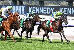 MELBOURNE, AUSTRALIA - MARCH 12: Craig Williams riding Barb Raider winning Race 5, TAB Kewney Stakes, during Melbourne Racing at Flemington Racecourse on March 12, 2022 in Melbourne, Australia. (Photo by Vince Caligiuri/Getty Images)