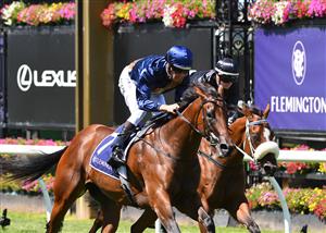 MELBOURNE, AUSTRALIA - MARCH 12: Hugh Bowman riding Glistening winning Race 3, the Moomba Plate, during Melbourne Racing at Flemington Racecourse on March 12, 2022 in Melbourne, Australia. (Photo by Vince Caligiuri/Getty Images)