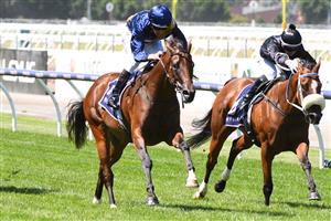 MELBOURNE, AUSTRALIA - MARCH 12: Hugh Bowman riding Glistening winning Race 3, the Moomba Plate, during Melbourne Racing at Flemington Racecourse on March 12, 2022 in Melbourne, Australia. (Photo by Vince Caligiuri/Getty Images)