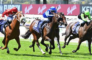 MELBOURNE, AUSTRALIA - MARCH 12: Jamie Kah riding Ruthless Dame winning Race 1, the Tbv Thoroughbred Breeders Stakes, during Melbourne Racing at Flemington Racecourse on March 12, 2022 in Melbourne, Australia. (Photo by Vince Caligiuri/Getty Images)
