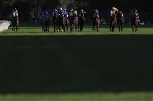 SYDNEY, AUSTRALIA - MARCH 12: Tommy Berry on Rousseau (white cap) wins race 10 the Corrine Handicap during Sydney Racing Chandon Ladies Day at Rosehill Gardens on March 12, 2022 in Sydney, Australia. (Photo by Mark Evans/Getty Images)
