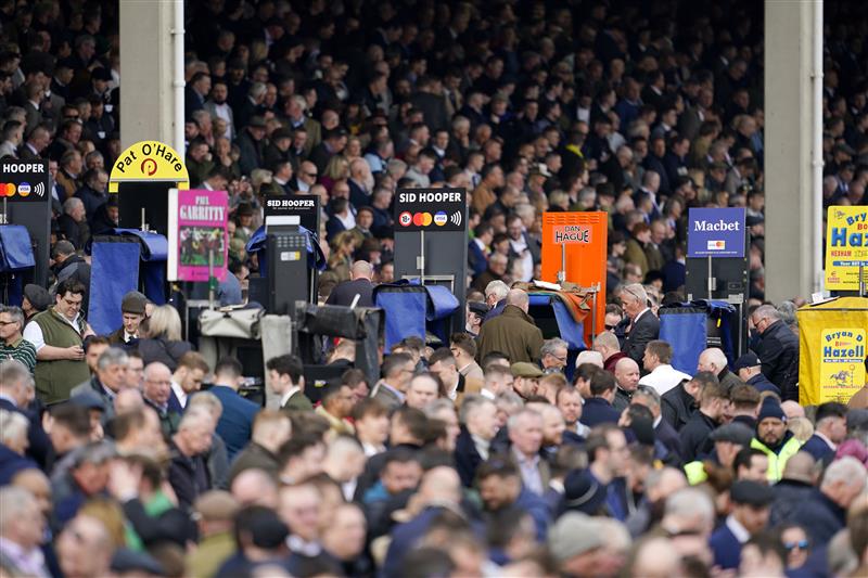 CHELTENHAM, ENGLAND - MARCH 15: A general view as racegoers are seen near the betting ring ahead of the Arkle Chase race during day one of the Cheltenham Festival 2022 at Cheltenham Racecourse on March 15, 2022 in Cheltenham, England. (Photo by Alan Crowhurst/Getty Images)