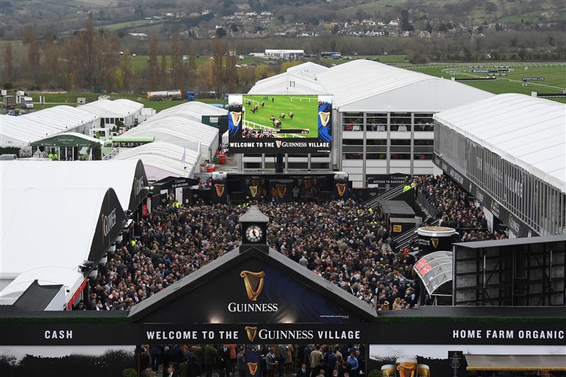 CHELTENHAM, ENGLAND - MARCH 15: A packed Guinness Village during the first day of The Festival at Cheltenham Racecourse on March 15, 2022 in Cheltenham, England. (Photo by Mike Hewitt/Getty Images)
