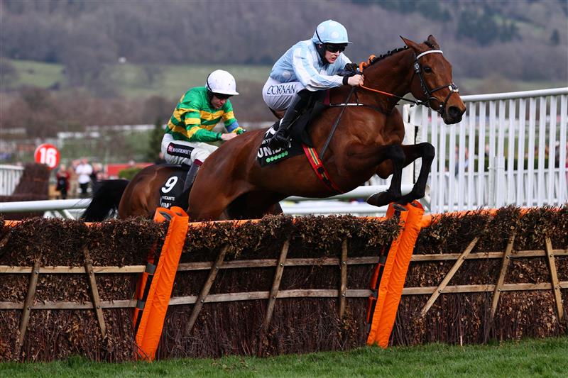 Jockey Rachael Blackmore rides Honeysuckle (R) to victory ahead of Aidan Coleman on Epatante (L) in the Champion Hurdle on the first day of the Cheltenham Festival at Cheltenham Racecourse, in Cheltenham, England on March 15, 2022. (Photo by Adrian DENNIS / AFP) (Photo by ADRIAN DENNIS/AFP via Getty Images)