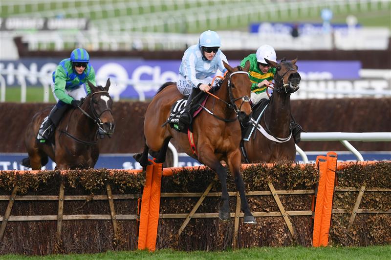 CHELTENHAM, ENGLAND - MARCH 15: Rachael Blackmore on Honeysuckle (blue and white cap) jump the last hurdle before Aidan Coleman on Epatante (white cap) and Paul Townend on Appreciate It (blue and green cap) to win The Unibet Champion Hurdle race during day one of the Cheltenham Festival 2022 at Cheltenham Racecourse on March 15, 2022 in Cheltenham, England. (Photo by Mike Hewitt/Getty Images)