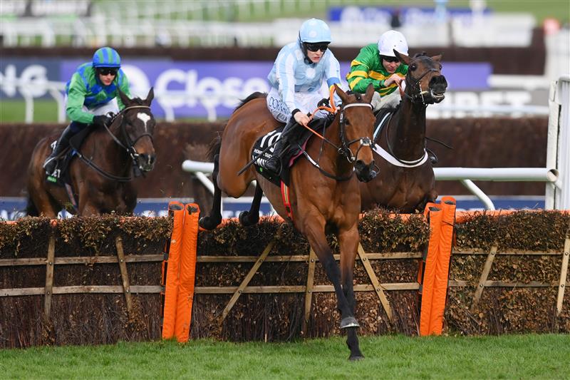 CHELTENHAM, ENGLAND - MARCH 15: Rachael Blackmore on Honeysuckle (blue and white cap) jump the last hurdle before Aidan Coleman on Epatante (white cap) and Paul Townend on Appreciate It (blue and green cap) to win The Unibet Champion Hurdle race during day one of the Cheltenham Festival 2022 at Cheltenham Racecourse on March 15, 2022 in Cheltenham, England. (Photo by Mike Hewitt/Getty Images)