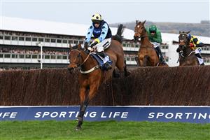 CHELTENHAM, ENGLAND - MARCH 15: Tom Cannon on Edwardstone (yellow cap, blue dots) clear the last hurdle to win theArkle Chase race during day one of the Cheltenham Festival 2022 at Cheltenham Racecourse on March 15, 2022 in Cheltenham, England. (Photo by Mike Hewitt/Getty Images)