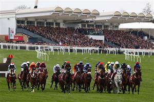 The field compete in the Ultima Handicap Chase on the first day of the Cheltenham Festival at Cheltenham Racecourse, in Cheltenham, England on March 15, 2022. (Photo by Adrian DENNIS / AFP) (Photo by ADRIAN DENNIS/AFP via Getty Images)