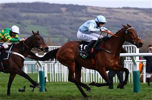 Jockey Rachael Blackmore rides Honeysuckle (R) to victory ahead of Aidan Coleman on Epatante (L) in the Champion Hurdle on the first day of the Cheltenham Festival at Cheltenham Racecourse, in Cheltenham, England on March 15, 2022. (Photo by Adrian DENNIS / AFP) (Photo by ADRIAN DENNIS/AFP via Getty Images)
