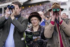 CHELTENHAM, ENGLAND - MARCH 15: Racegoers watch the action from the lawns on day one of The Festival at Cheltenham Racecourse on March 15, 2022 in Cheltenham, England. (Photo by Alan Crowhurst/Getty Images)