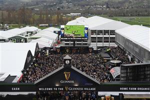 CHELTENHAM, ENGLAND - MARCH 15: A packed Guinness Village during the first day of The Festival at Cheltenham Racecourse on March 15, 2022 in Cheltenham, England. (Photo by Mike Hewitt/Getty Images)