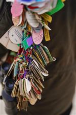CHELTENHAM, ENGLAND - MARCH 15: A racegoer with badges from many days racing throughout the years on day one of The Festival at Cheltenham Racecourse on March 15, 2022 in Cheltenham, England. (Photo by Alan Crowhurst/Getty Images)