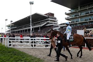 Jockey Rachael Blackmore on hot favourite, Honeysuckle, walk out onto the course ahead of the Champion Hurdle on the first day of the Cheltenham Festival at Cheltenham Racecourse, in Cheltenham, England on March 15, 2022. (Photo by Adrian DENNIS / AFP) (Photo by ADRIAN DENNIS/AFP via Getty Images)