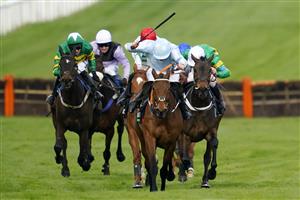 CHELTENHAM, ENGLAND - MARCH 15: Rachel Blackmore on Honeysuckle (blue and white cap) approach the finish line before Aidan Coleman on Epatante (white cap) and Jack Kennedy on Zanahiyr (red cap) to win The Unibet Champion Hurdle race during day one of the Cheltenham Festival 2022 at Cheltenham Racecourse on March 15, 2022 in Cheltenham, England. (Photo by Alan Crowhurst/Getty Images)