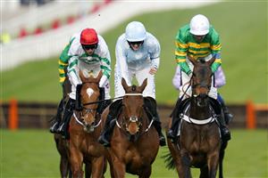 CHELTENHAM, ENGLAND - MARCH 15: Rachel Blackmore on Honeysuckle (blue and white cap) approach the finish line before Aidan Coleman on Epatante (white cap) and Jack Kennedy on Zanahiyr (red cap) to win The Unibet Champion Hurdle race during day one of the Cheltenham Festival 2022 at Cheltenham Racecourse on March 15, 2022 in Cheltenham, England. (Photo by Alan Crowhurst/Getty Images)