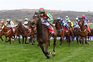 CHELTENHAM, ENGLAND - MARCH 15: Tom Scudamore (green and red cap) riding Gericault Roque after crossing the third last hurdle in the Ultima Handicap Chase race during day one of the Cheltenham Festival 2022 at Cheltenham Racecourse on March 15, 2022 in Cheltenham, England. (Photo by Mike Hewitt/Getty Images)