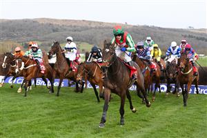 CHELTENHAM, ENGLAND - MARCH 15: Tom Scudamore (green and red cap) riding Gericault Roque after crossing the third last hurdle in the Ultima Handicap Chase race during day one of the Cheltenham Festival 2022 at Cheltenham Racecourse on March 15, 2022 in Cheltenham, England. (Photo by Mike Hewitt/Getty Images)