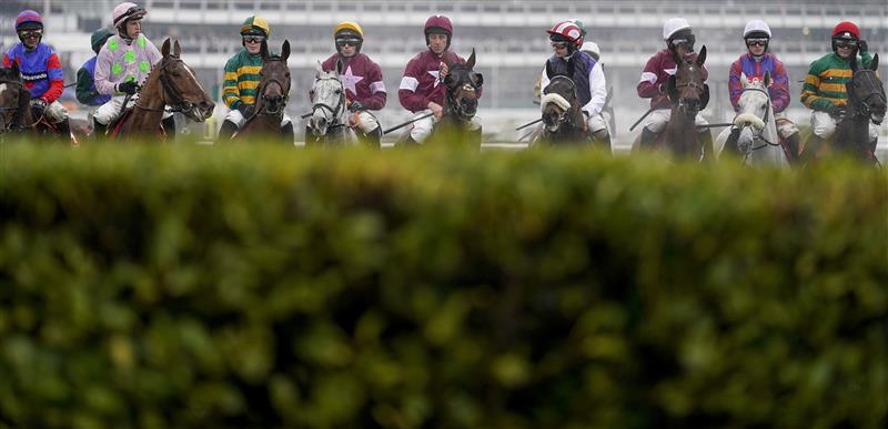 CHELTENHAM, ENGLAND - MARCH 16: Davy Russell riding Tiger Roll (C, purple cap) during The Glenfarclas Chase on day two of The Festival at Cheltenham Racecourse on March 16, 2022 in Cheltenham, England. (Photo by Alan Crowhurst/Getty Images)