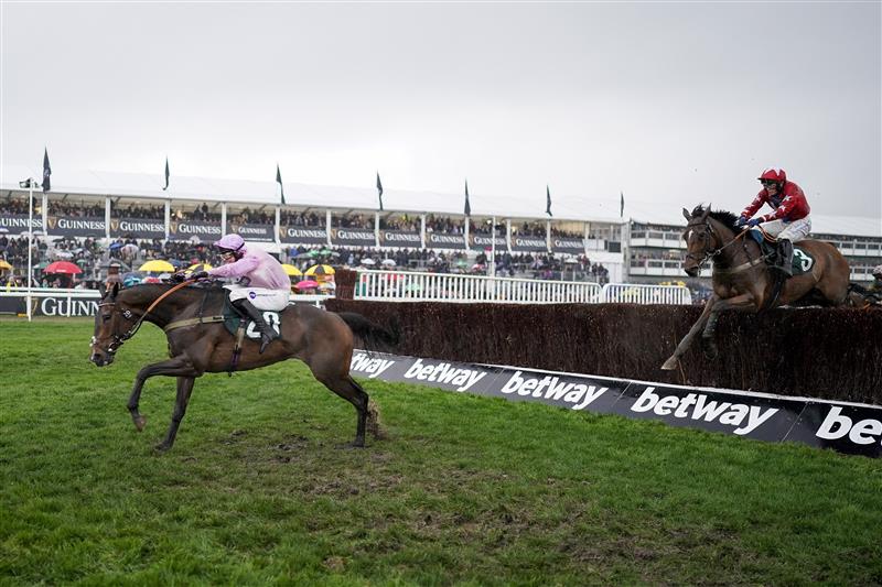 CHELTENHAM, ENGLAND - MARCH 16: Kielan Woods riding Global Citizen clear the last to win The Johnny Henderson Grand Annual Challenge Cup Handicap Chase on day two of The Festival at Cheltenham Racecourse on March 16, 2022 in Cheltenham, England. (Photo by Alan Crowhurst/Getty Images)