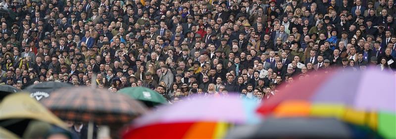 CHELTENHAM, ENGLAND - MARCH 16: A very wet day as racegoers watch the first race on day two of The Festival at Cheltenham Racecourse on March 16, 2022 in Cheltenham, England. (Photo by Alan Crowhurst/Getty Images)