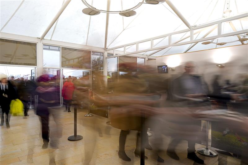 CHELTENHAM, ENGLAND - MARCH 16: The doors open as racegoers make a dash through the entrance on day two of The Festival at Cheltenham Racecourse on March 16, 2022 in Cheltenham, England. (Photo by Alan Crowhurst/Getty Images)