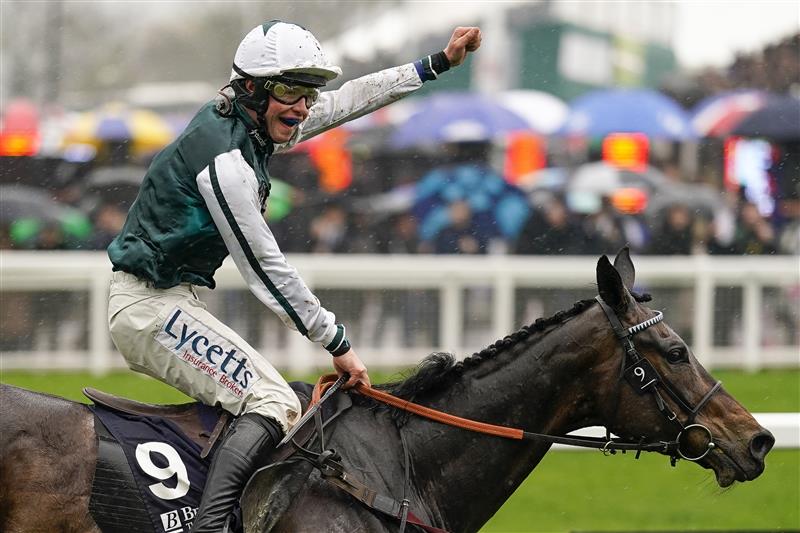 CHELTENHAM, ENGLAND - MARCH 16: Charlie Deutsch celebrates as he rides L'Homme Presse to victory in The Brown Advisory Novices' Chase on day two of The Festival at Cheltenham Racecourse on March 16, 2022 in Cheltenham, England. (Photo by Alan Crowhurst/Getty Images)