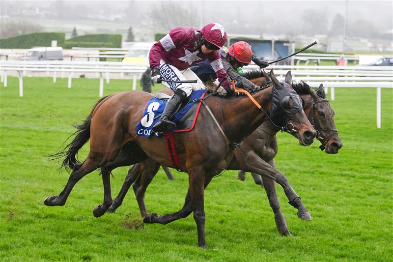CHELTENHAM, ENGLAND - MARCH 16: Shane Fitzgerald (white star kit) on Commander Of Fleet approach the finish line before Darragh O'Keeffe (red cap) on Fastorslow to win the Coral Cup Handicap Hurdle race during day two of Cheltenham Festival 2022 at Cheltenham Racecourse on March 16, 2022 in Cheltenham, England. (Photo by Mike Hewitt/Getty Images)