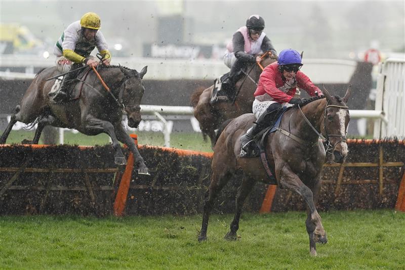 CHELTENHAM, ENGLAND - MARCH 16: Paul Townend riding Sir Gerhard (red) clear the last to win The Ballymore Novices' Hurdle on day two of The Festival at Cheltenham Racecourse on March 16, 2022 in Cheltenham, England. (Photo by Alan Crowhurst/Getty Images)