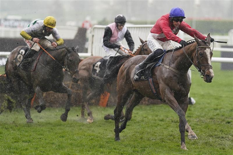 CHELTENHAM, ENGLAND - MARCH 16: Paul Townend riding Sir Gerhard (red) clear the last to win The Ballymore Novices' Hurdle on day two of The Festival at Cheltenham Racecourse on March 16, 2022 in Cheltenham, England. (Photo by Alan Crowhurst/Getty Images)