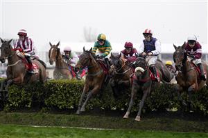 CHELTENHAM, ENGLAND - MARCH 16: Davy Russell riding Tiger Roll (C, purple cap) during The Glenfarclas Chase on day two of The Festival at Cheltenham Racecourse on March 16, 2022 in Cheltenham, England. (Photo by Alan Crowhurst/Getty Images)