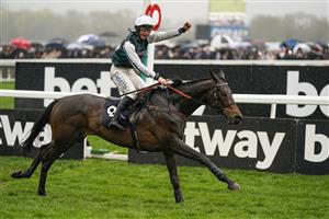 CHELTENHAM, ENGLAND - MARCH 16: Charlie Deutsch celebrates as he rides L'Homme Presse to victory in The Brown Advisory Novices' Chase on day two of The Festival at Cheltenham Racecourse on March 16, 2022 in Cheltenham, England. (Photo by Alan Crowhurst/Getty Images)