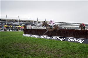 CHELTENHAM, ENGLAND - MARCH 16: Kielan Woods riding Global Citizen clear the last to win The Johnny Henderson Grand Annual Challenge Cup Handicap Chase on day two of The Festival at Cheltenham Racecourse on March 16, 2022 in Cheltenham, England. (Photo by Alan Crowhurst/Getty Images)