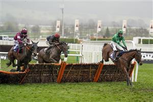 CHELTENHAM, ENGLAND - MARCH 16: Shane Fitzgerald riding Commander Of Fleet (maroon) clear the last to win The Coral Cup Handicap Hurdle on day two of The Festival at Cheltenham Racecourse on March 16, 2022 in Cheltenham, England. (Photo by Alan Crowhurst/Getty Images)