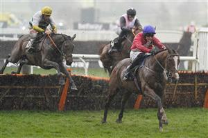 CHELTENHAM, ENGLAND - MARCH 16: Paul Townend riding Sir Gerhard (red) clear the last to win The Ballymore Novices' Hurdle on day two of The Festival at Cheltenham Racecourse on March 16, 2022 in Cheltenham, England. (Photo by Alan Crowhurst/Getty Images)