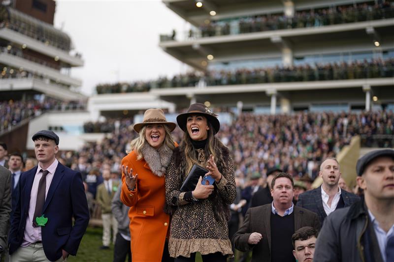 CHELTENHAM, ENGLAND - MARCH 17: Cheering on a winner on day three of The Festival at Cheltenham Racecourse on March 17, 2022 in Cheltenham, England. (Photo by Alan Crowhurst/Getty Images)