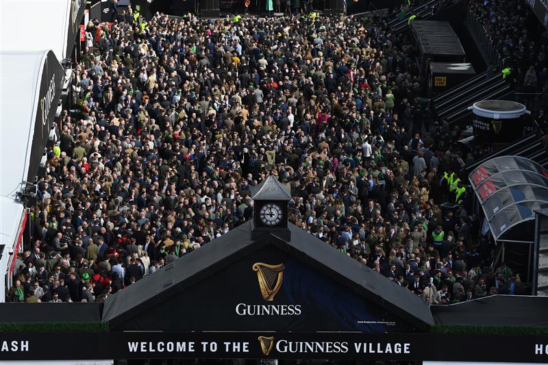 CHELTENHAM, ENGLAND - MARCH 17: The Guinness Village is packed on St Patrick's Day on day three of the Cheltenham Festival 2022 at Cheltenham Racecourse on March 17, 2022 in Cheltenham, England. (Photo by Mike Hewitt/Getty Images)