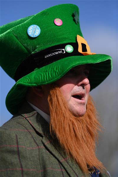 CHELTENHAM, ENGLAND - MARCH 17: An Irish themed spectator arrives on St Patrick's Day on day three of the Cheltenham Festival 2022 at Cheltenham Racecourse on March 17, 2022 in Cheltenham, England. (Photo by Mike Hewitt/Getty Images)