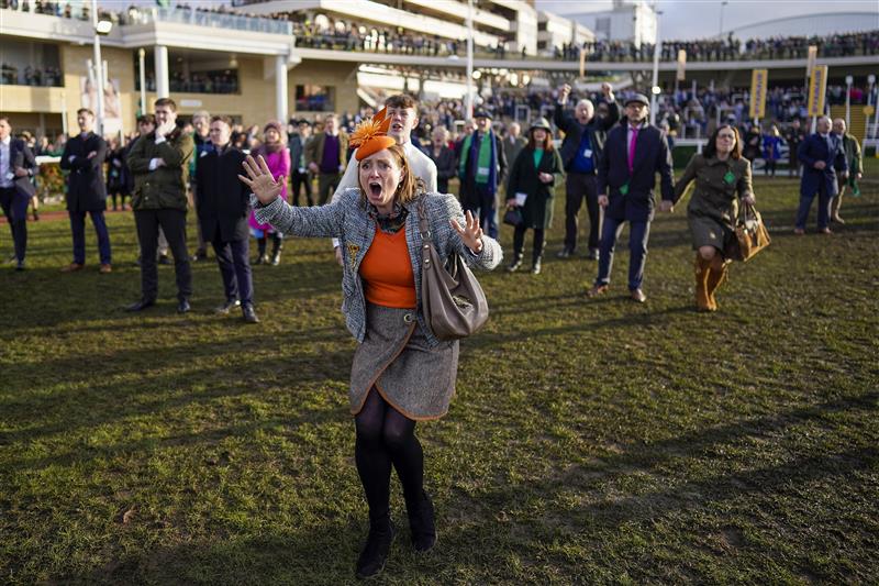 CHELTENHAM, ENGLAND - MARCH 17: Reactions from the winning connections of Love Envoi as they watch their horse on the big screen win The Ryanair Mares' Novices' Hurdleon day three of The Festival at Cheltenham Racecourse on March 17, 2022 in Cheltenham, England. (Photo by Alan Crowhurst/Getty Images)