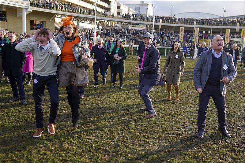 CHELTENHAM, ENGLAND - MARCH 17: Reactions from the winning connections of Love Envoi as they watch their horse on the big screen win The Ryanair Mares' Novices' Hurdleon day three of The Festival at Cheltenham Racecourse on March 17, 2022 in Cheltenham, England. (Photo by Alan Crowhurst/Getty Images)