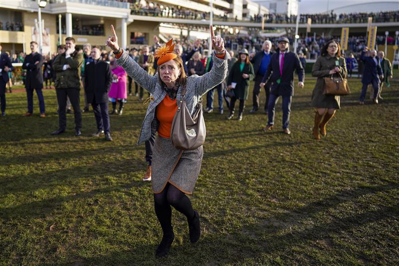CHELTENHAM, ENGLAND - MARCH 17: Reactions from the winning connections of Love Envoi as they watch their horse on the big screen win The Ryanair Mares' Novices' Hurdleon day three of The Festival at Cheltenham Racecourse on March 17, 2022 in Cheltenham, England. (Photo by Alan Crowhurst/Getty Images)