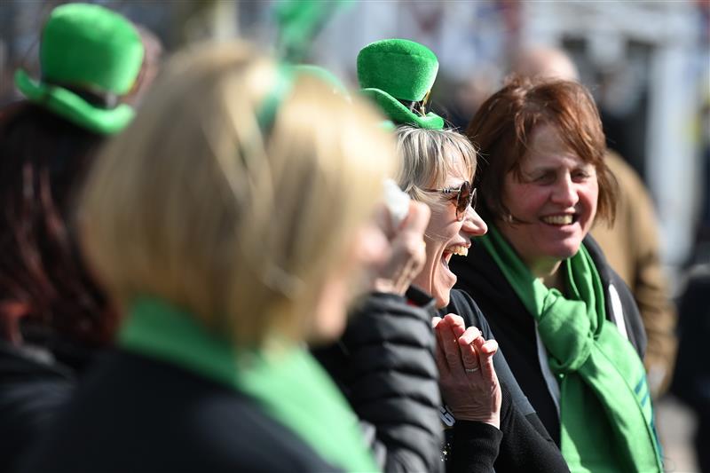 CHELTENHAM, ENGLAND - MARCH 17: Irish themed spectators arrive on St Patrick's Day on day three of the Cheltenham Festival 2022 at Cheltenham Racecourse on March 17, 2022 in Cheltenham, England. (Photo by Mike Hewitt/Getty Images)