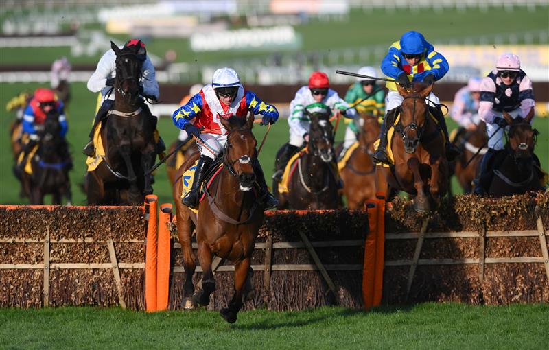 CHELTENHAM, ENGLAND - MARCH 17: Jonathan Burke (white cap) on Love Envoi clear the last to win The Dawn Run Mares’ Novices’ Hurdle race during day three of The Cheltenham Festival 2022 at Cheltenham Racecourse on March 17, 2022 in Cheltenham, England. (Photo by Mike Hewitt/Getty Images)
