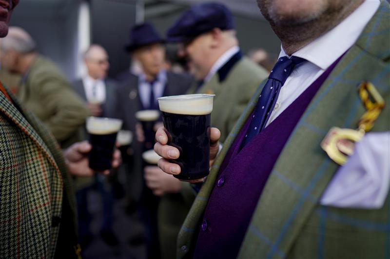 CHELTENHAM, ENGLAND - MARCH 17: Racegoers in the Guinness Village on St Patrick's Day on day three of The Festival at Cheltenham Racecourse on March 17, 2022 in Cheltenham, England. (Photo by Alan Crowhurst/Getty Images)