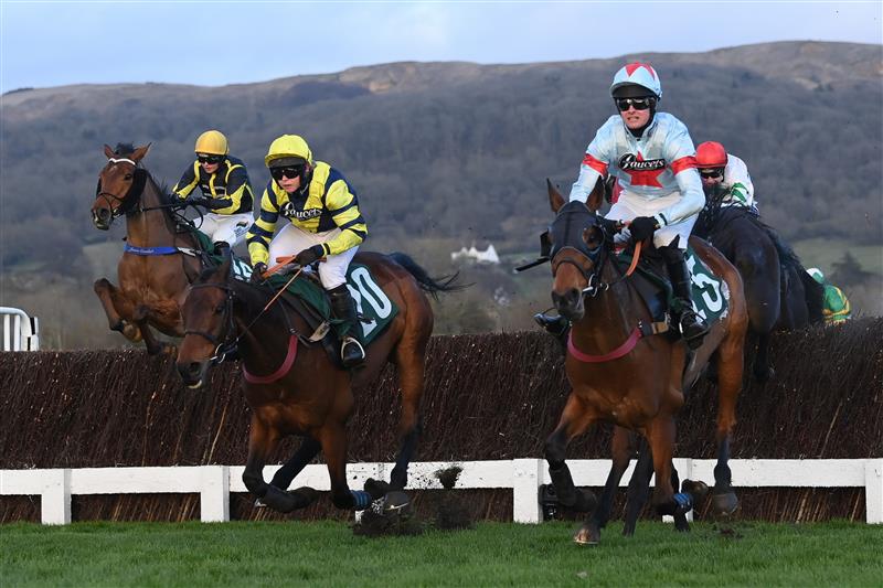 CHELTENHAM, ENGLAND - MARCH 17: Lucy Turner on Chambard (20) jumps the 3rd last on their way to victory in the Fulke Walwyn Kim Muir Challenge Cup Amateur Jockeys' Handicap Chase on day three of the Cheltenham Festival 2022 at Cheltenham Racecourse on March 17, 2022 in Cheltenham, England. (Photo by Mike Hewitt/Getty Images)