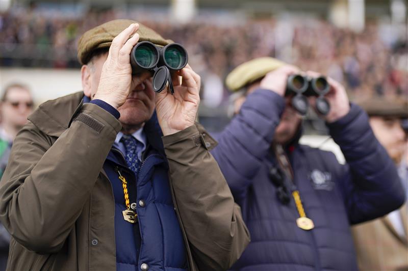 CHELTENHAM, ENGLAND - MARCH 17: Keeping an eye on the action on day three of The Festival at Cheltenham Racecourse on March 17, 2022 in Cheltenham, England. (Photo by Alan Crowhurst/Getty Images)