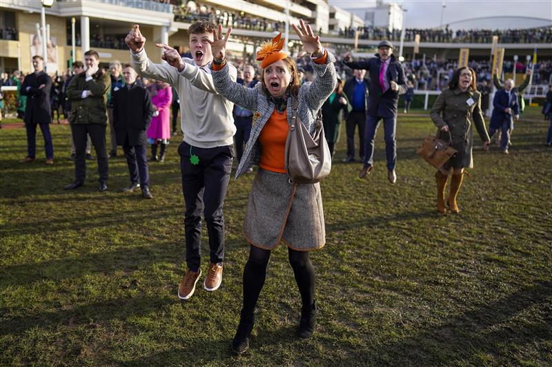 CHELTENHAM, ENGLAND - MARCH 17: Reactions from the winning connections of Love Envoi as they watch their horse on the big screen win The Ryanair Mares' Novices' Hurdleon day three of The Festival at Cheltenham Racecourse on March 17, 2022 in Cheltenham, England. (Photo by Alan Crowhurst/Getty Images)